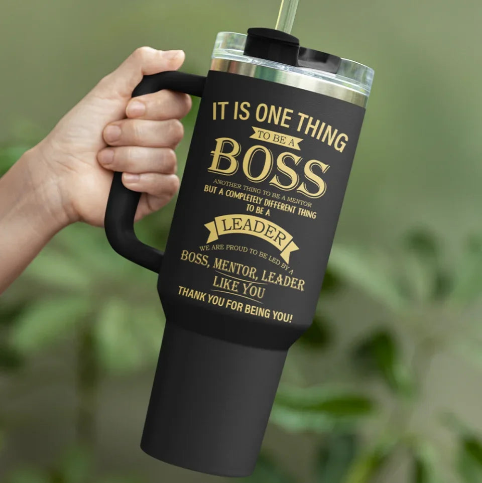 mockup-of-a-person-s-hand-holding-a-sublimated-stanley-tumbler-m51045