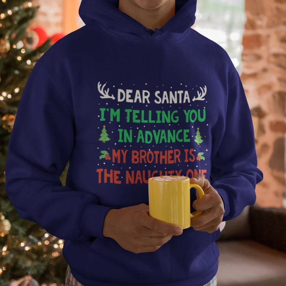 mockup-of-a-man-wearing-a-hoodie-in-front-of-a-christmas-tree-23507