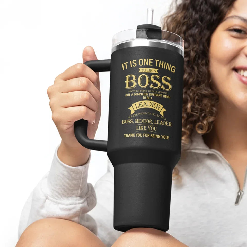 mockup-of-a-cheerful-woman-holding-a-stanley-tumbler-m40303